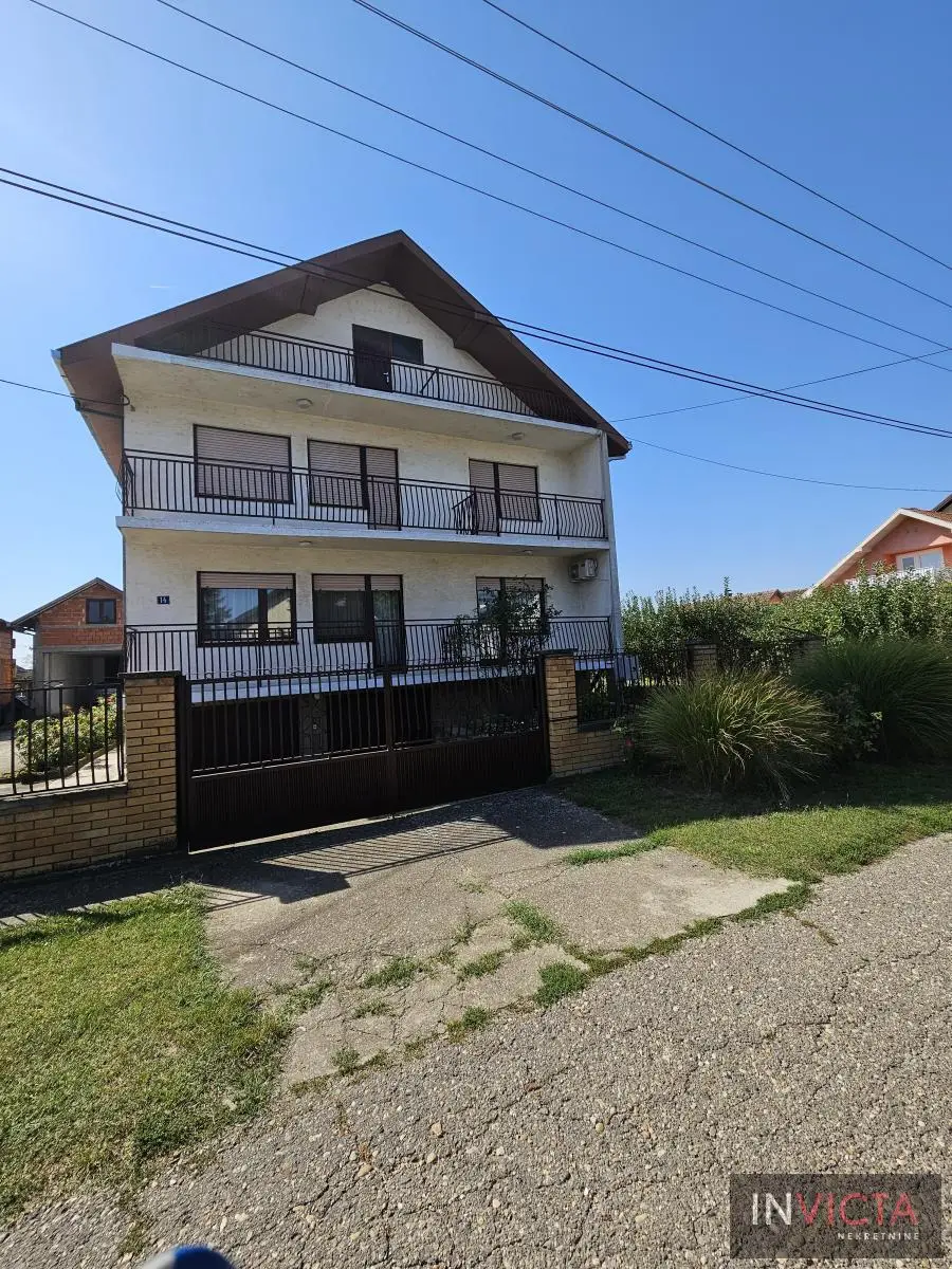 Family house with three residential units and commercial building