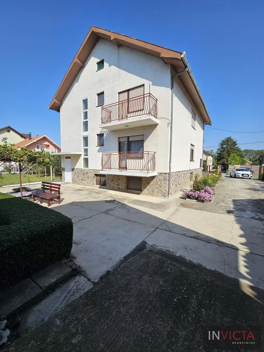 Family house with three residential units and business space